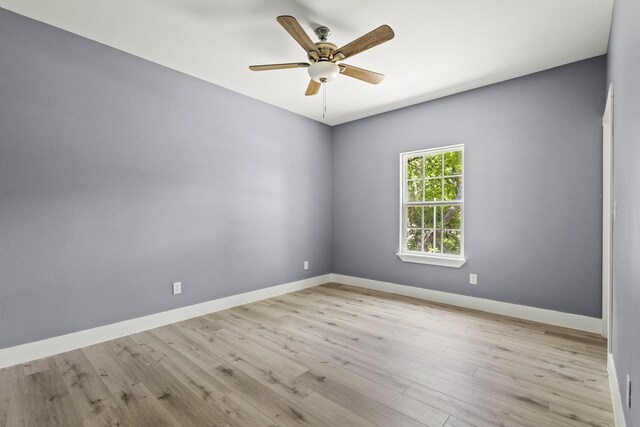 620 S First St, Sherman, TX 75090 - empty room with ceiling fan, wood finished floors, and baseboards