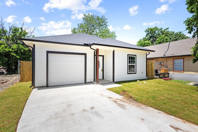 620 S First St, Sherman, TX 75090 - view of front facade featuring an attached garage, driveway, and roof with shingles