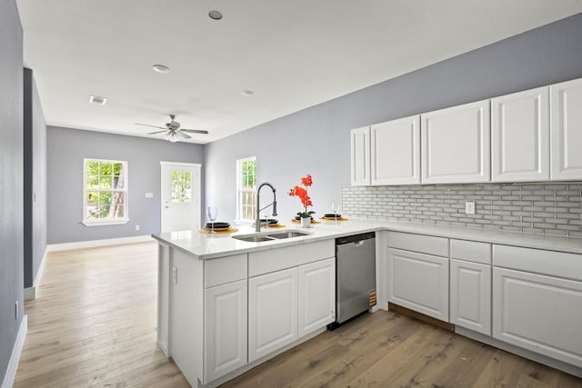 620 S First St, Sherman, TX 75090 - kitchen with dishwasher, a sink, a peninsula, a ceiling fan, and light countertops