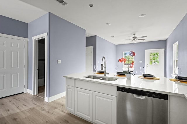 620 S First St, Sherman, TX 75090 - kitchen with dishwasher, a sink, light wood finished floors, a ceiling fan, and white cabinets