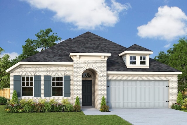 view of front facade featuring an attached garage, concrete driveway, a front yard, and roof with shingles