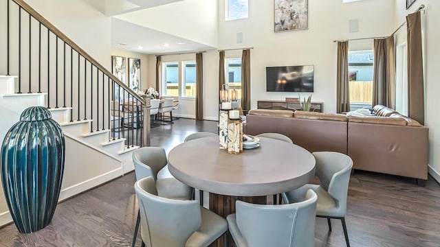 3523 San Clemente Dr, Melissa, TX 75454 - dining space with stairway, a high ceiling, baseboards, and wood finished floors
