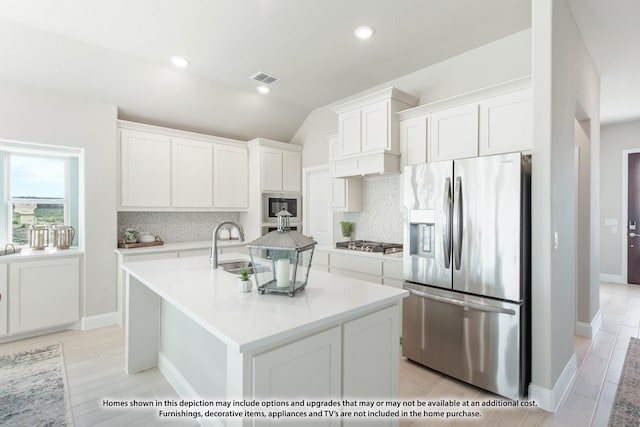 1286 Emily Dr, Trenton, TX 75490 - kitchen featuring stainless steel appliances, backsplash, white cabinetry, light countertops, and lofted ceiling