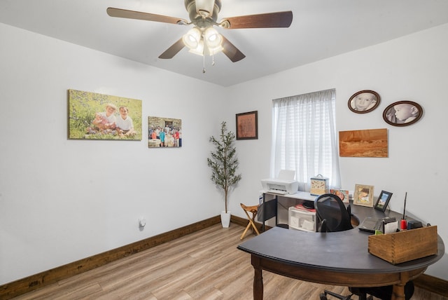 home office with ceiling fan, light wood-style flooring, and baseboards