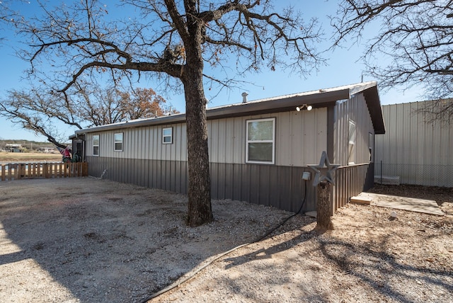 view of property exterior with fence