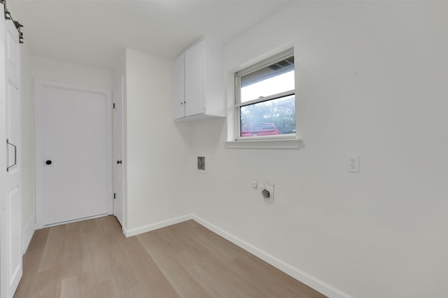 4032 Aragon Dr, Fort Worth, TX 76133 - laundry room with cabinet space, light wood-type flooring, hookup for a washing machine, baseboards, and hookup for an electric dryer