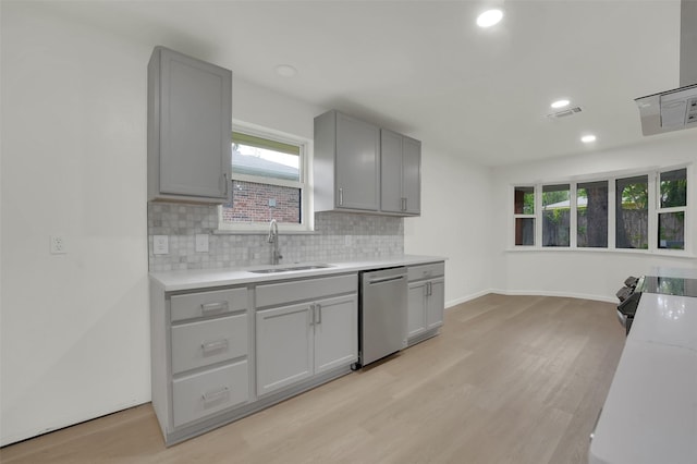4032 Aragon Dr, Fort Worth, TX 76133 - kitchen with dishwasher, a sink, gray cabinets, light wood-style flooring, and recessed lighting