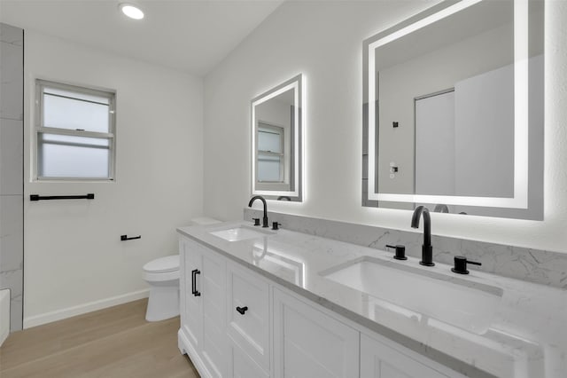 4032 Aragon Dr, Fort Worth, TX 76133 - full bath featuring toilet, wood finished floors, double vanity, and baseboards
