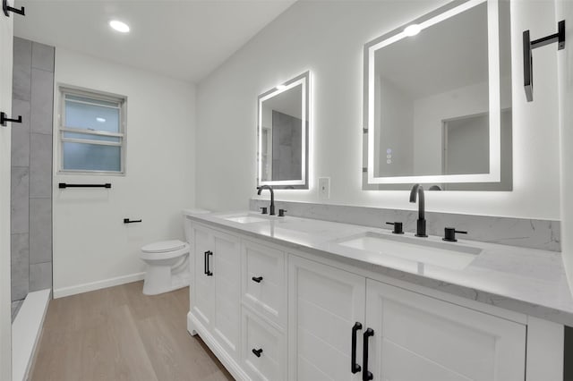 4032 Aragon Dr, Fort Worth, TX 76133 - full bath with wood finished floors, toilet, double vanity, tiled shower, and recessed lighting