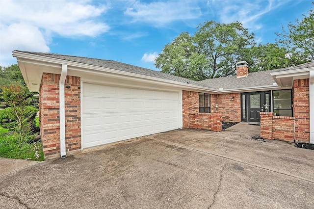 4032 Aragon Dr, Fort Worth, TX 76133 - view of property exterior featuring brick siding, driveway, an attached garage, a chimney, and a shingled roof