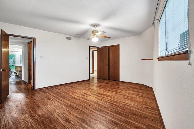 18206 Valley Vw, Forney, TX 75126 - empty room with wood finished floors, plenty of natural light, and baseboards
