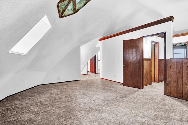 18206 Valley Vw, Forney, TX 75126 - unfurnished living room featuring vaulted ceiling, carpet, and a skylight