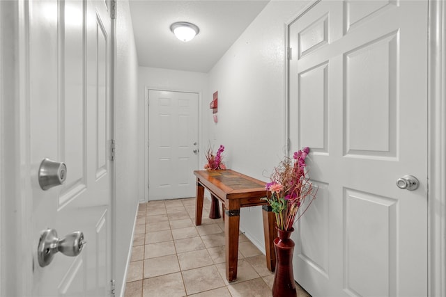 420 Whitney Ct, Rio Vista, TX 76093 - doorway featuring baseboards and light tile patterned floors
