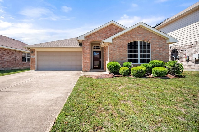 ranch-style house with brick siding, a front lawn, concrete driveway, and an attached garage