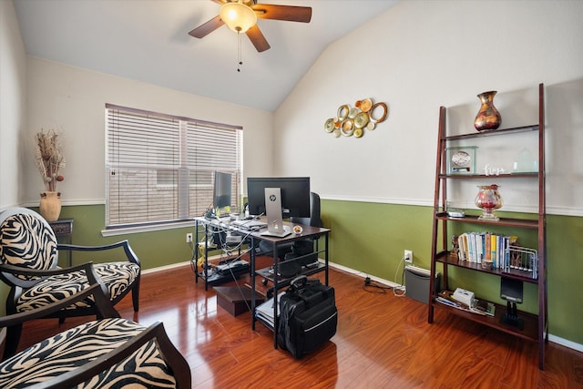 home office featuring ceiling fan, vaulted ceiling, wood finished floors, and baseboards