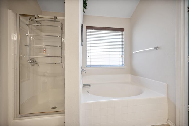 full bath with a garden tub and a stall shower