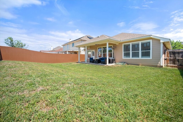 rear view of house featuring a patio and an outdoor living space