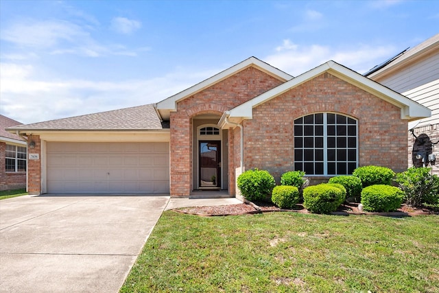 ranch-style home featuring brick siding, a front lawn, concrete driveway, and an attached garage