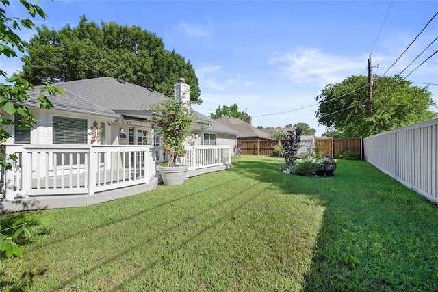 view of yard with a deck