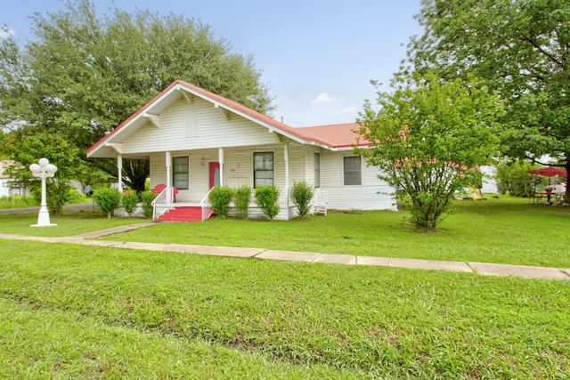 101 E Reed St, Randolph, TX 75475 - view of front of property featuring a porch, a front yard, and metal roof
