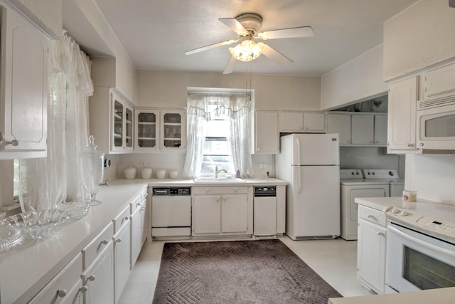 101 E Reed St, Randolph, TX 75475 - kitchen with white appliances, independent washer and dryer, a sink, a ceiling fan, and light countertops