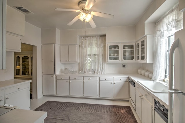 101 E Reed St, Randolph, TX 75475 - kitchen with a ceiling fan, white cabinets, light countertops, and glass insert cabinets