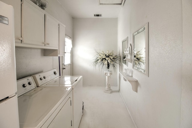 101 E Reed St, Randolph, TX 75475 - laundry room featuring washing machine and dryer, cabinet space, and baseboards