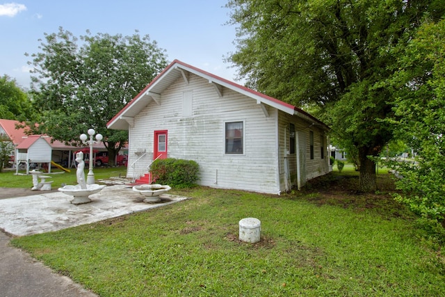 101 E Reed St, Randolph, TX 75475 - view of front of home with a front lawn and a patio area