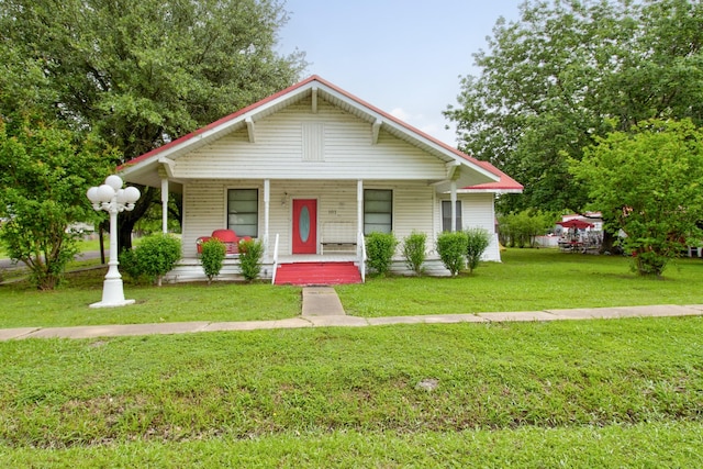 101 E Reed St, Randolph, TX 75475 - bungalow featuring a porch and a front lawn