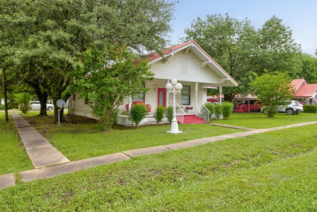101 E Reed St, Randolph, TX 75475 - bungalow featuring covered porch and a front lawn