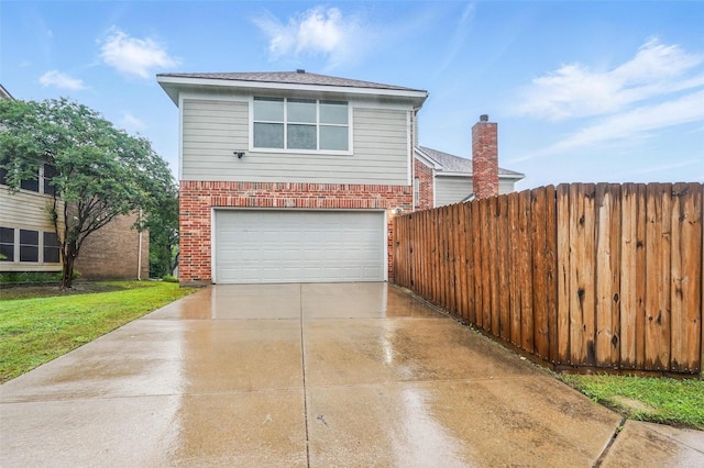 view of home's exterior featuring brick siding, driveway, a garage, and fence