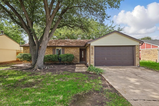 5220 Alpha Dr, The Colony, TX 75056 - ranch-style home with an attached garage, driveway, and brick siding