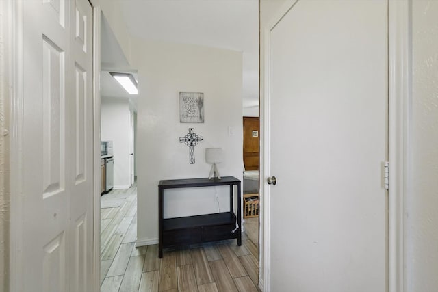 5220 Alpha Dr, The Colony, TX 75056 - hall featuring wood finish floors and baseboards