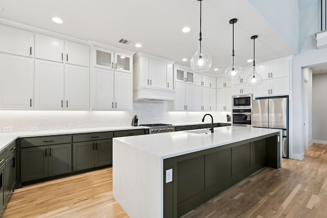 13417 Meadow Cross Dr, Fort Worth, TX 76008 - kitchen with stainless steel appliances, a sink, decorative backsplash, recessed lighting, and light countertops
