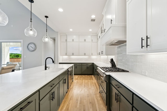 13417 Meadow Cross Dr, Fort Worth, TX 76008 - kitchen with a sink, light countertops, decorative backsplash, white cabinets, and recessed lighting