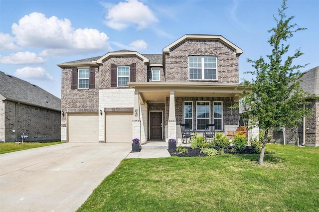 view of front of house featuring brick siding, covered porch, a front yard, and concrete driveway