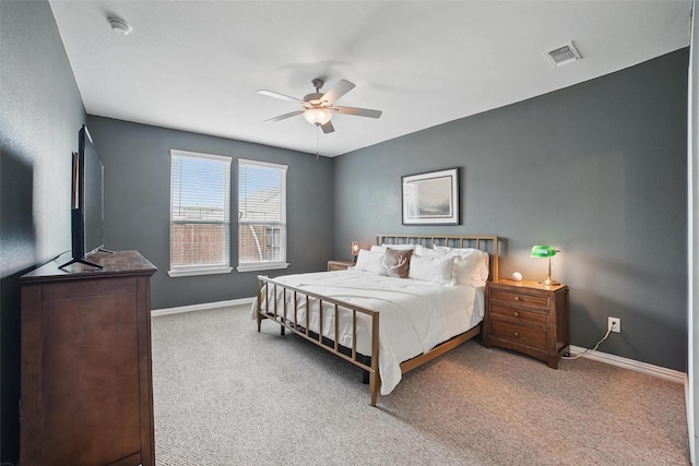 carpeted bedroom with baseboards and ceiling fan