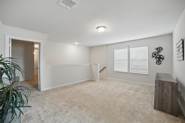 below grade area featuring carpet flooring and baseboards