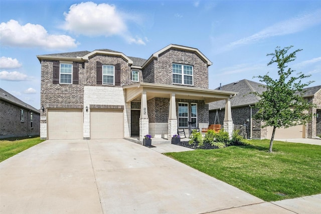 view of front of property with brick siding, a front lawn, an attached garage, driveway, and covered porch