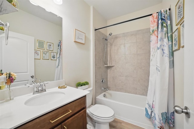full bath with shower / bathtub combination with curtain, toilet, and vanity
