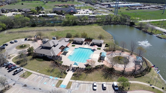 aerial view of property's location with a nearby body of water and a pool area