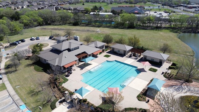 aerial view of residential area with a pool area