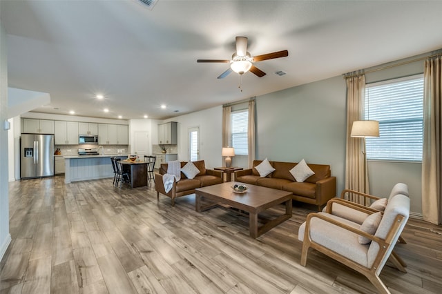 2665 Kings Canyon Mews, Corinth, TX 76210 - living room featuring a ceiling fan, healthy amount of natural light, light wood-type flooring, and recessed lighting