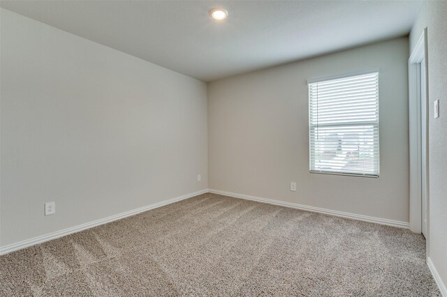 2665 Kings Canyon Mews, Corinth, TX 76210 - carpeted empty room with baseboards