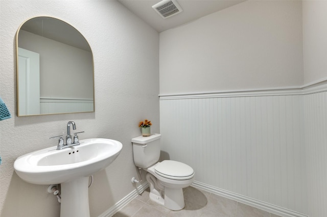 2665 Kings Canyon Mews, Corinth, TX 76210 - half bathroom featuring toilet, tile patterned floors, and baseboards