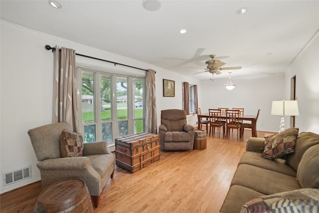4548 Ivy Dr, Mesquite, TX 75150 - living area with light wood-type flooring, ceiling fan, and recessed lighting