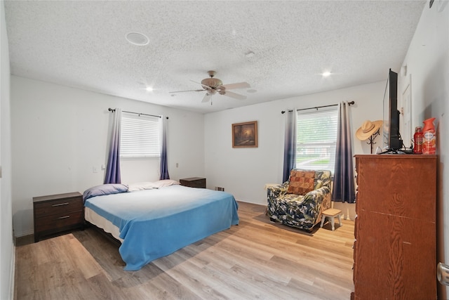 4548 Ivy Dr, Mesquite, TX 75150 - bedroom with a textured ceiling, wood finished floors, a ceiling fan, and recessed lighting