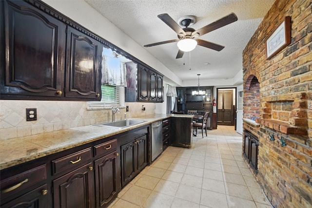 4548 Ivy Dr, Mesquite, TX 75150 - kitchen featuring a sink, stainless steel dishwasher, a textured ceiling, a ceiling fan, and light tile patterned floors