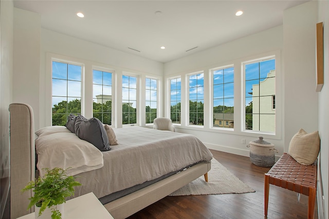 bedroom featuring dark wood-style flooring, recessed lighting, and baseboards