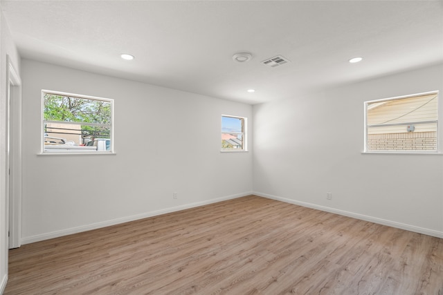 118 Mockingbird Ln, Hillsboro, TX 76645 - empty room with light wood-style floors, healthy amount of natural light, baseboards, and recessed lighting